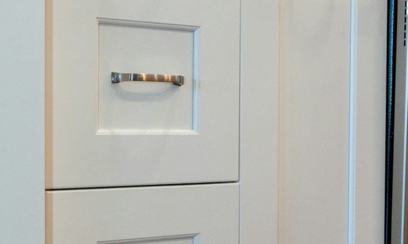 White shaker cabinet drawer fronts with brushed nickel pulls