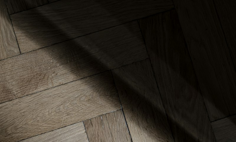 Oak herringbone flooring in raking light